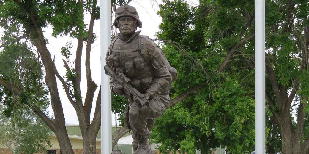 a bronze statue of a soldier