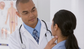 a physician examining a patient