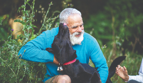 an older man with his dog