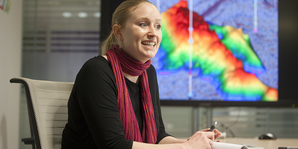 woman smiling in conference room