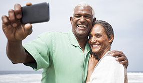 a middle-aged couple taking a selfie