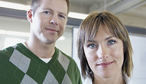 closeup of a man and a woman at an office
