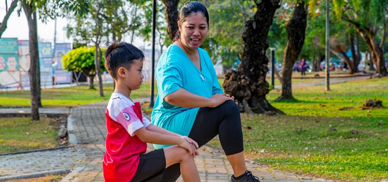 mother and son stretching