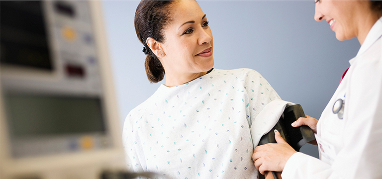 woman getting her blood pressure checked