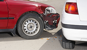 close-up of two cars' front and back bumpers after a crash