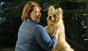 Lady playing with her dog