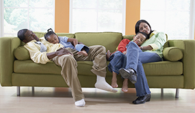 family lounging on couch