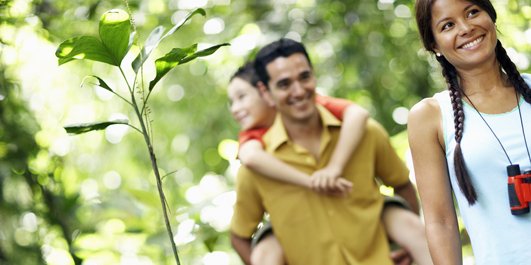 a family walking in the woods