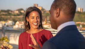 man and woman talking outdoors