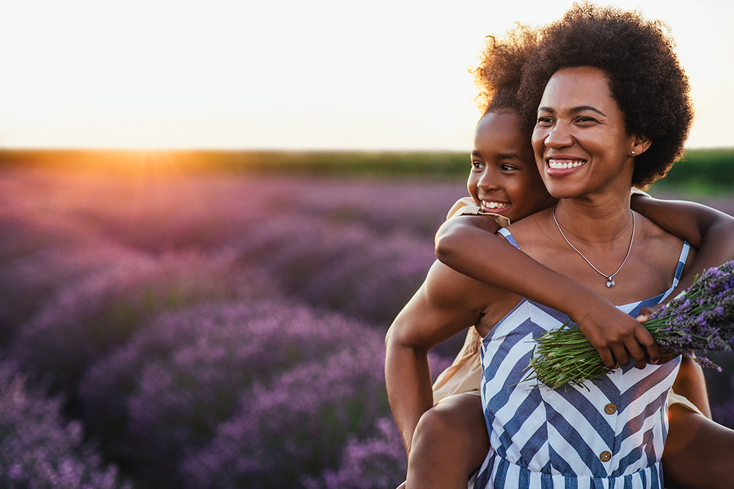 mother and her daughter bonding together outdoors at the lavender field