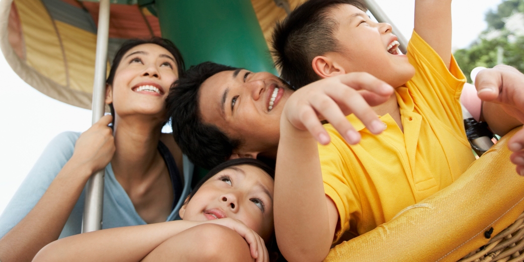 a family looking upward and having fun