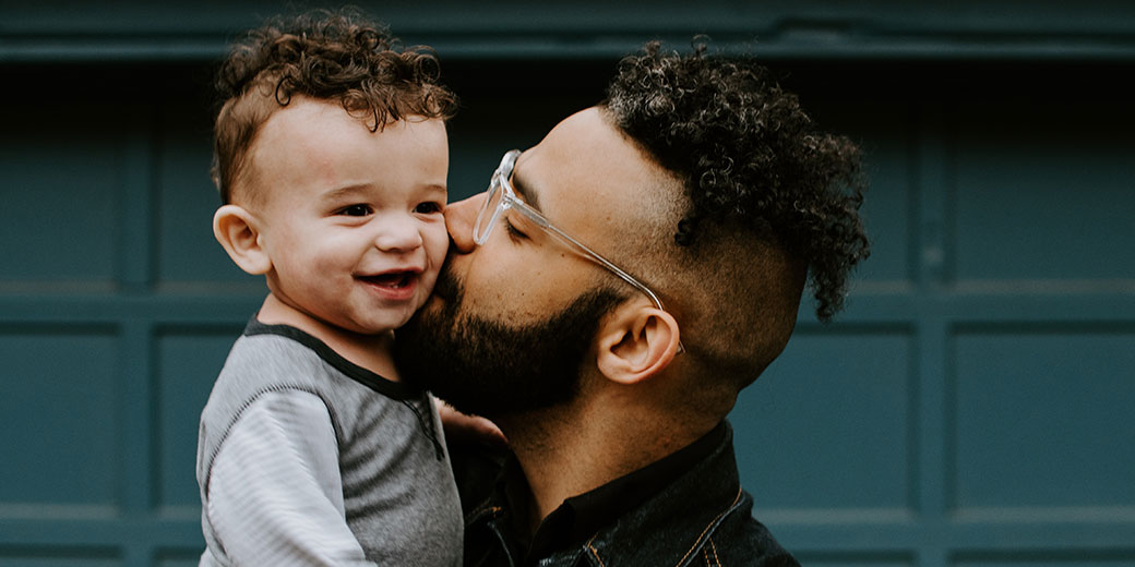 a man holding a toddler